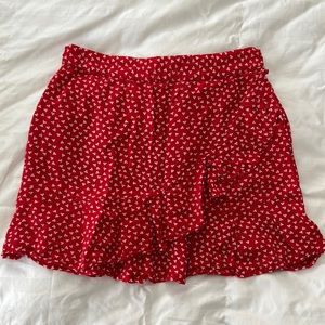 Cute mini skirt with ruffle across the front.